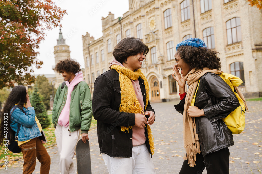 Fototapeta premium Young multiracial students smiling and talking