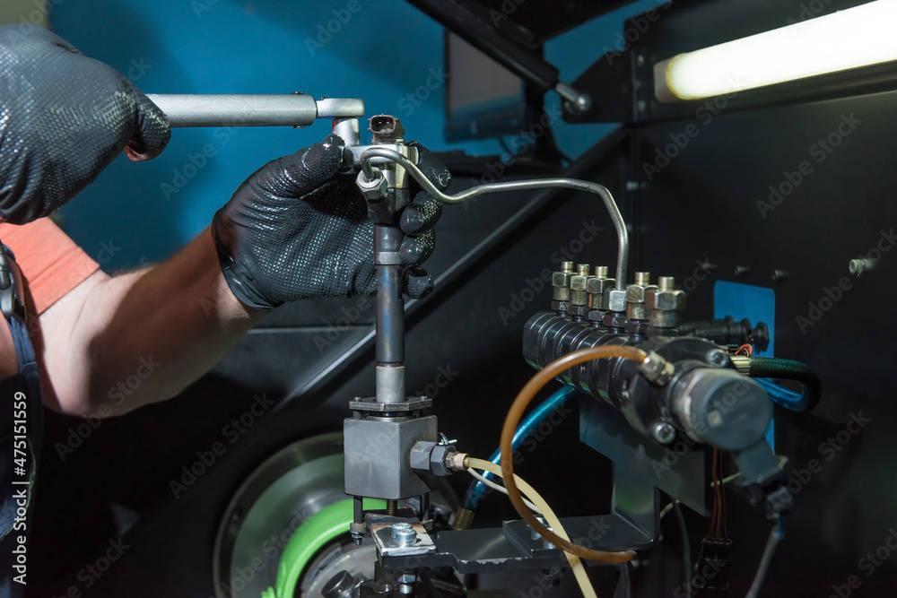 Obraz premium Repair of diesel car injectors.