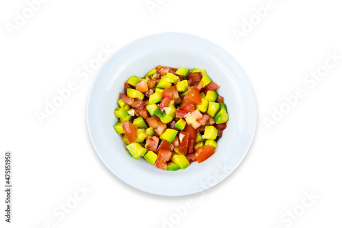 White plate with avocado and tomato salad, top view, flatlay, isolated on white background