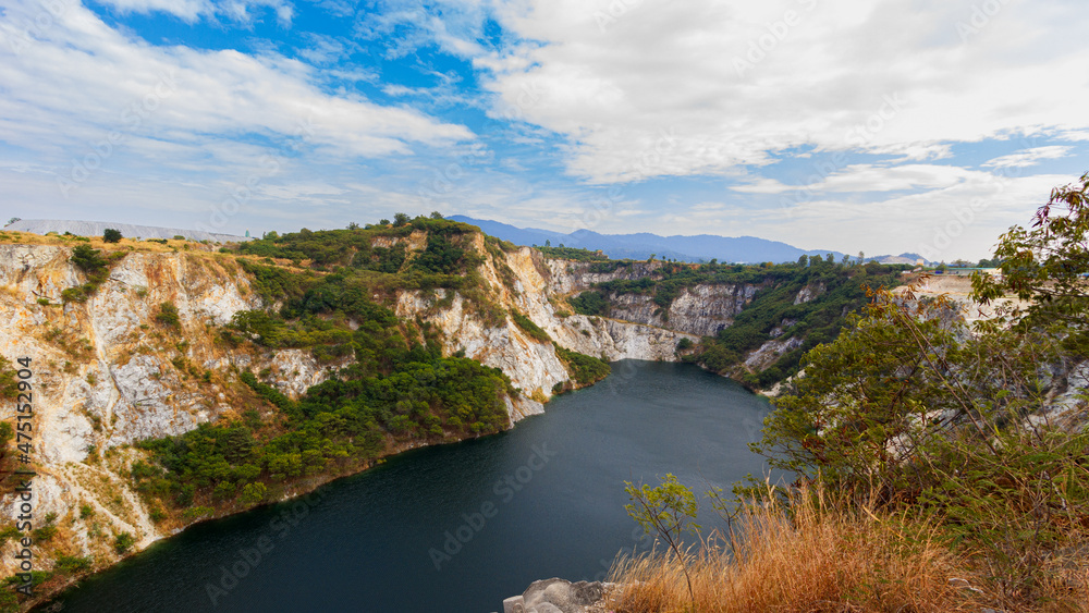 Grand Canyon, a quarry that looks like a rocky mountain with a river in the middle, in Chonburi Province, Thailand.