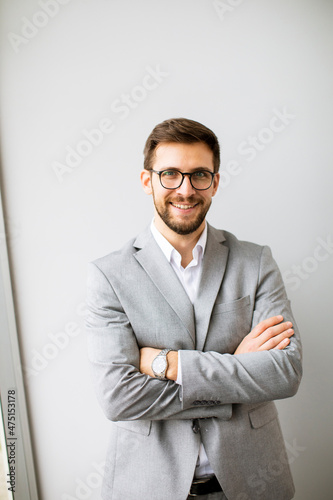 Young modern businessman st...