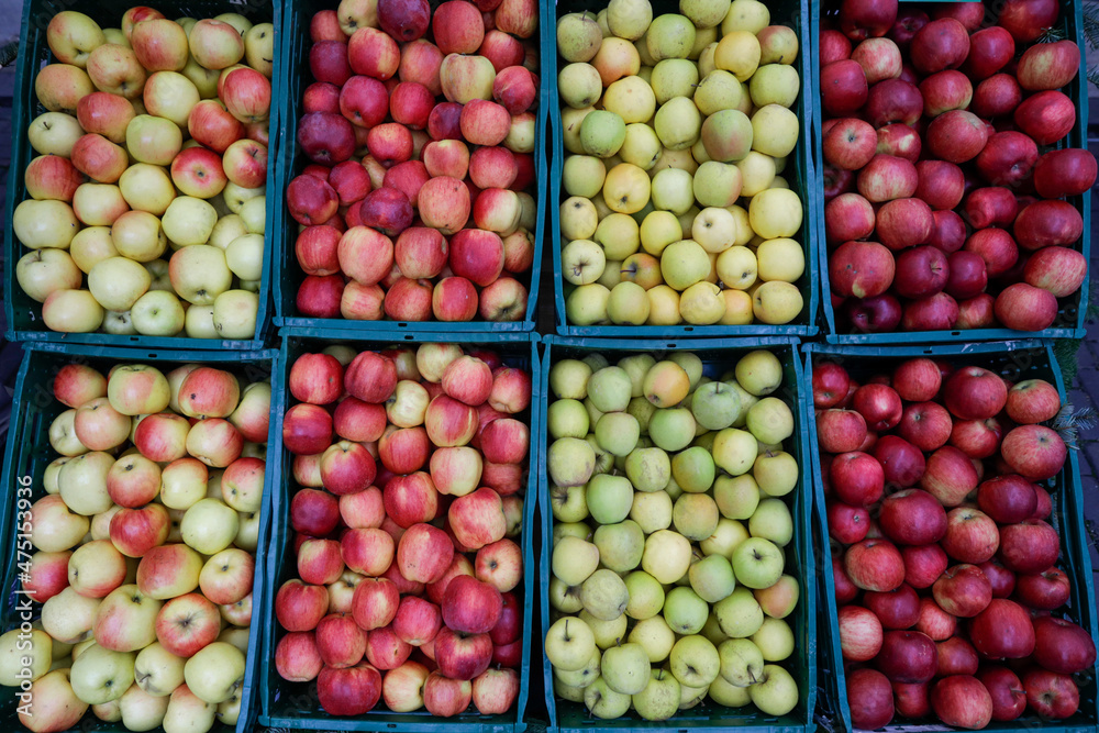 Shallow depth of field (selective focus) image with organic fresh apples for sale in an outdoors market in Bucharest, Romania.