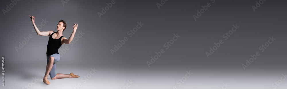 graceful ballet dancer in black tank top gesturing during performance on dark grey, banner graceful ballet dancer in black tank top gesturing during performance on dark grey, banner