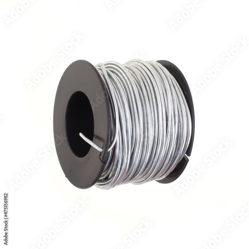 Roll of 14 gauge steel wire isolated on white