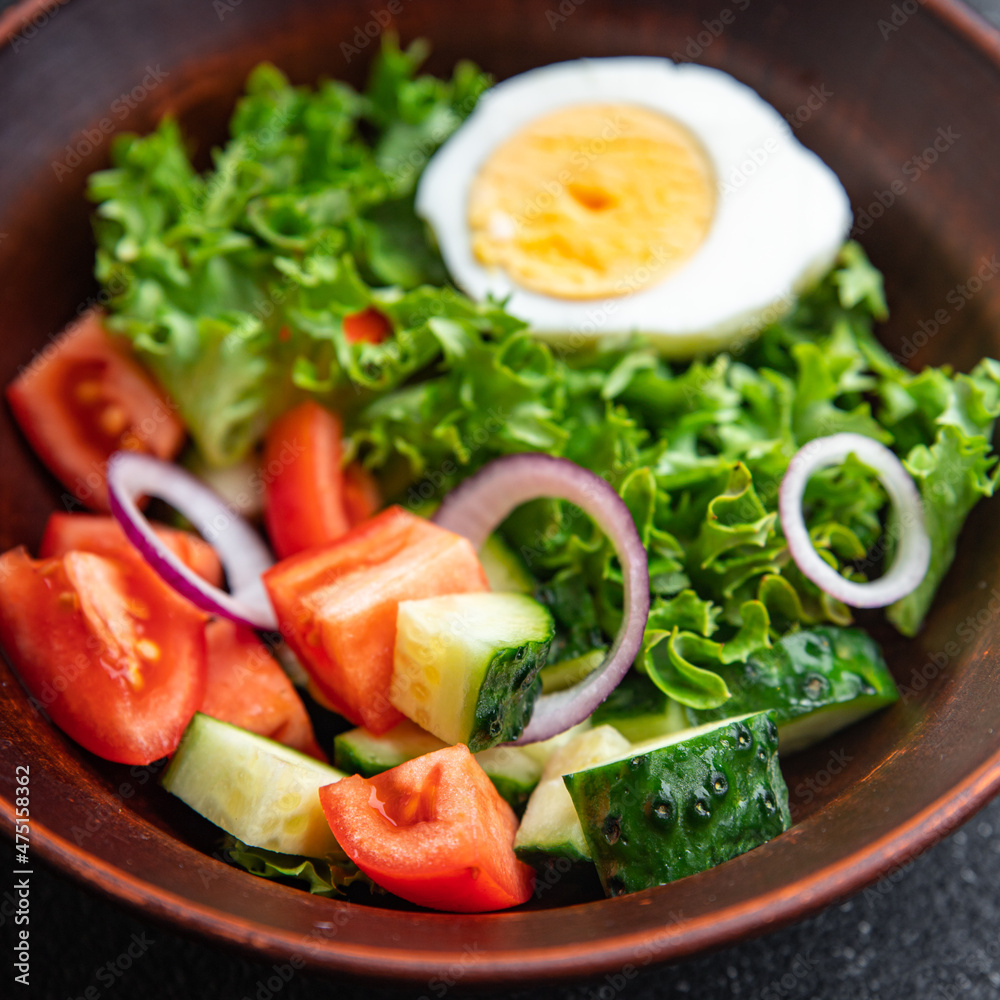 vegetables salad boiled egg cucumber, tomato, onion, lettuce healthy meal food diet snack on the table copy space food background rustic. top view keto or paleo diet vegetables salad boiled egg cucumber, tomato, onion, lettuce healthy meal food diet snack on the table copy space food background rustic. top view keto or paleo diet