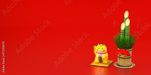 赤い背景に置かれた門松と虎の招き猫 / コピースペースのあるお正月用背景素材 / 初売り・新春セール・商売繁盛・千客万来のコンセプトイメージ / 3Dレンダリンググラフィックス