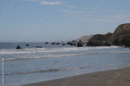 Coastline view with beach and rocks © Tirzah