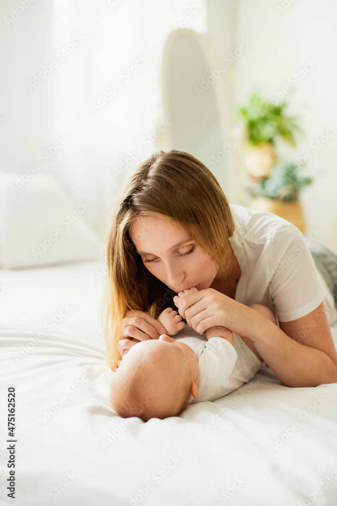 Happy young mother with her newborn baby at home. Happy young mother with her newborn baby at home.