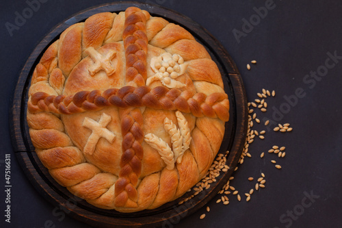 Serbian slava cake with a cross, top view.  Slavski kolač. Decorative bread for traditional celebration. photo