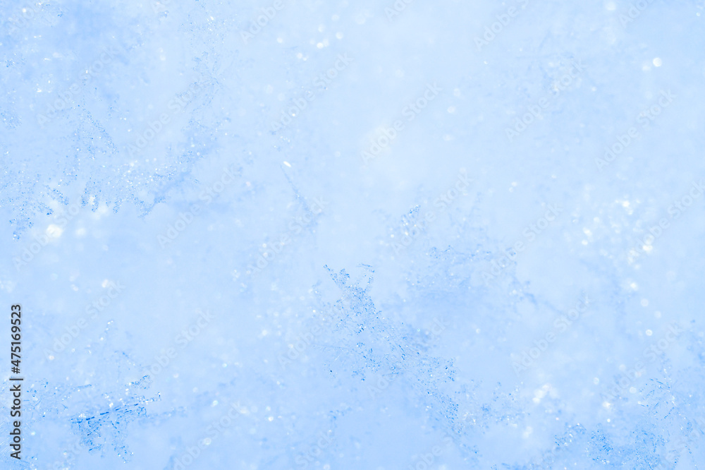 Obraz premium Natural frosty snowflakes during a snowfall. Lot of snowflakes on the surface of a snowdrift, macrophotography