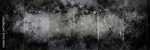 Dark scary grunge black and white paint splatter wood fence background horror theme