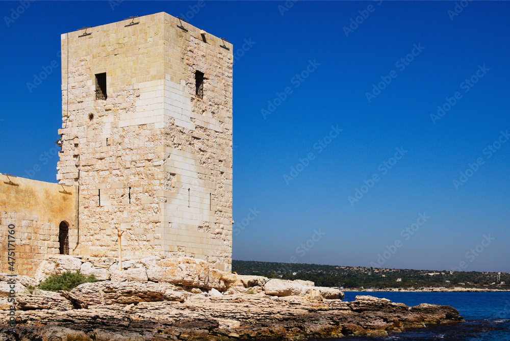 Close-up view of defensive wall and tower of ancient Kizkalesi castle (Maiden's Castle). It is island medieval fortress near Kizkalesi town. Famous touristic place and travel destination
