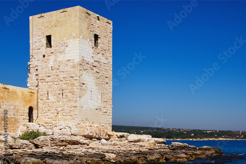 Close-up view of defensive wall and tower of ancient Kizkalesi castle  Maiden s Castle . It is island medieval fortress near Kizkalesi town. Famous touristic place and travel destination