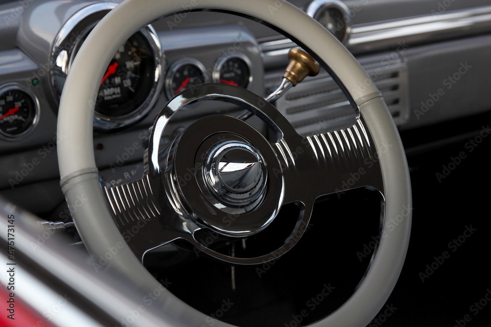 Classic retro beautiful red car. Close up steering wheel