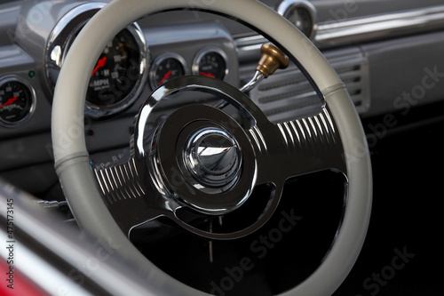 Classic retro beautiful red car. Close up steering wheel
