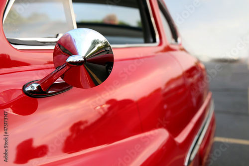 Classic retro beautiful red car. Close up mirror.