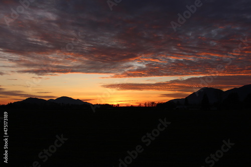 Red and orange sunset with clouds in the mountains  located in Chilliwack BC Canada near Vancouver  Whistler  Squamish  Abbotsford and Hope.