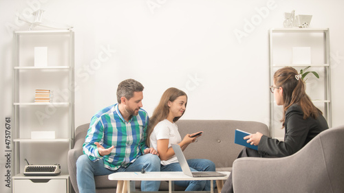phone addicted kid with daddy sitting at psychologist solving problem, family