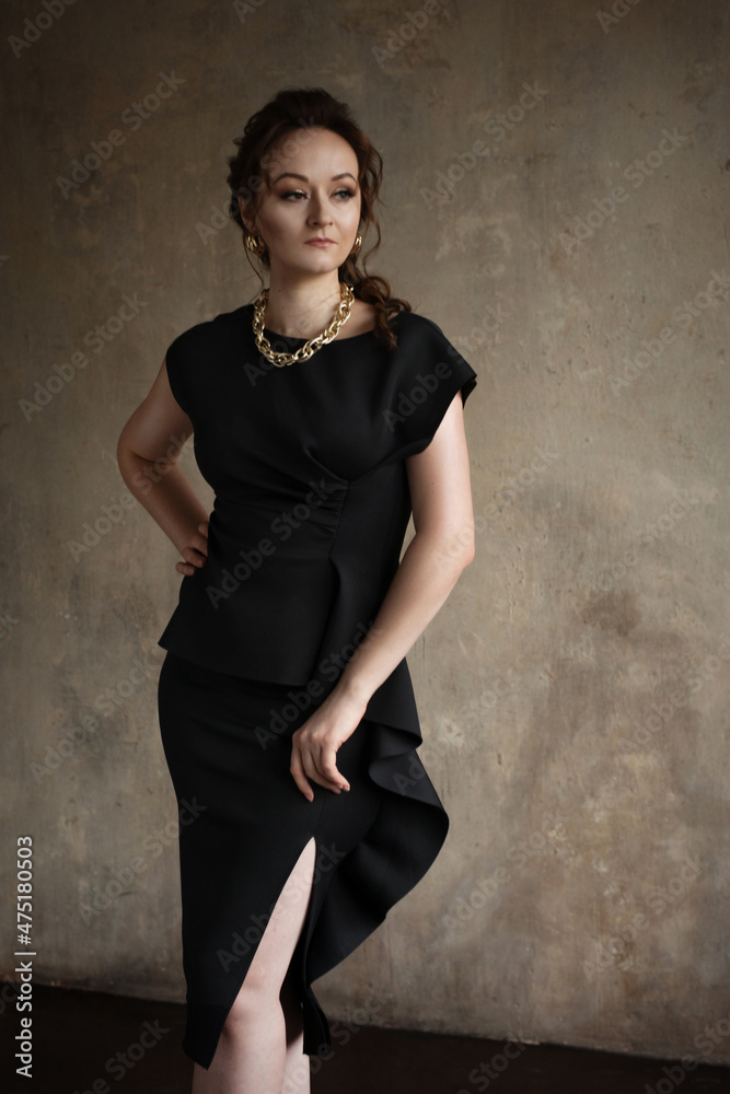 A beautiful young girl posing in an interior photo studio. A beautiful young girl posing in an interior photo studio.