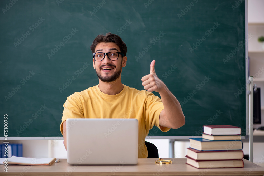 Young male student in telestudying concept