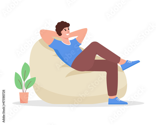 Relaxed young man sitting in armchair. Male person freelancer resting and thinking about something good or chilling on bean bag after work. Flat or cartoon Vector illustration.