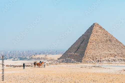 landscape of giza plateau with pyramids at background