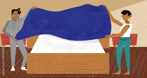 Lesbian couple making the bed 