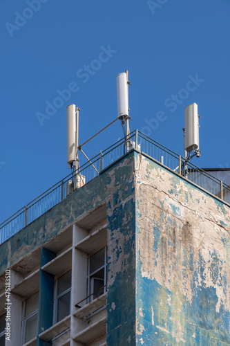 Mobile communication base station, on building. Telecommunication tower.