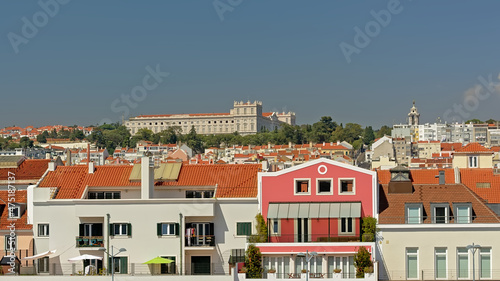 Apartment buildings and Ajuda national palace on the hills of Lisbon, Portugal