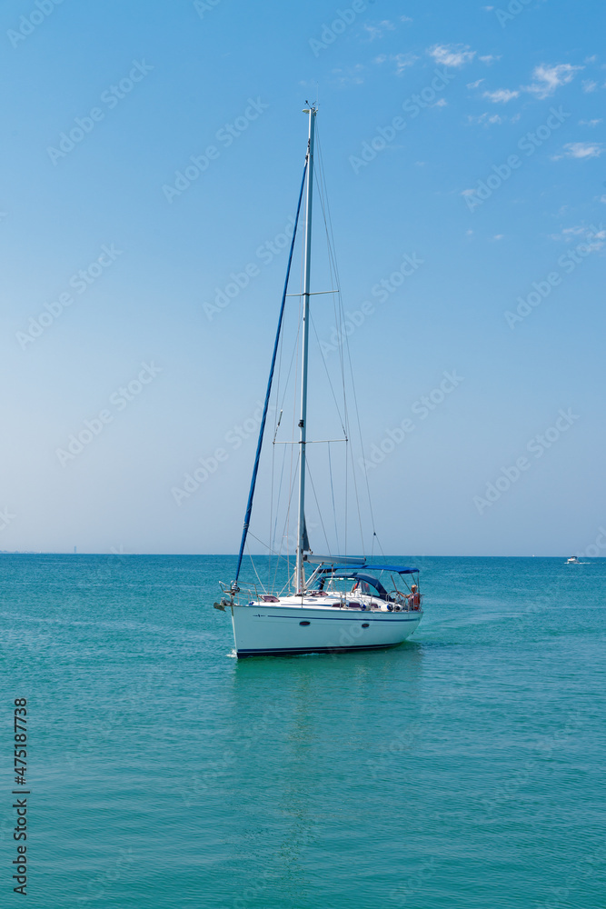 Small yacht sailing in a sea