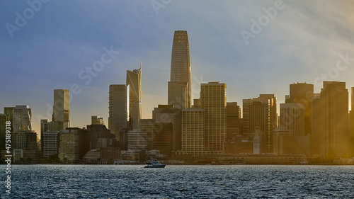 San Francisco Ca. Bay and skyline at sunset with the sunlight making the buildings glow