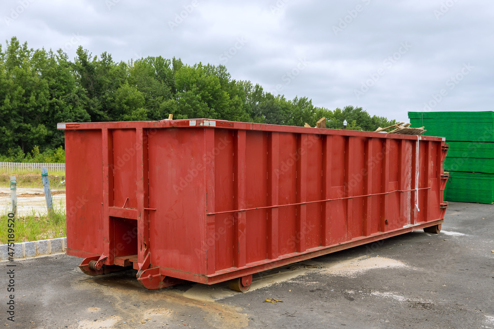 Recycling garbage waste management container with construction material in the new building construction Recycling garbage waste management container with construction material in the new building construction