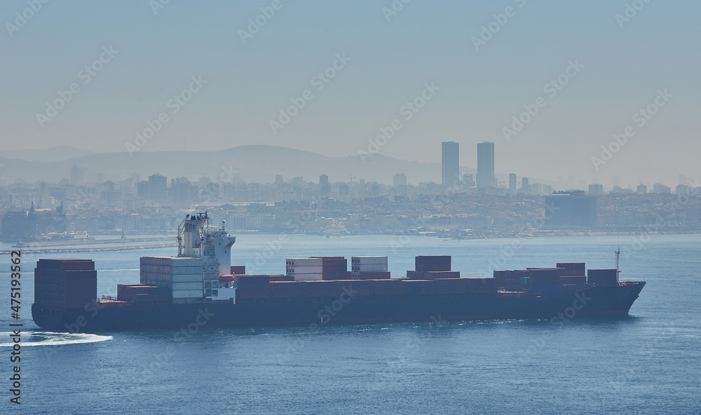 Fully loaded container ship moving through Bosprus