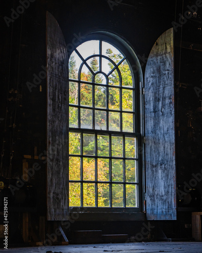 old arched window in the historic Weston village playhouse theater in Vermont 