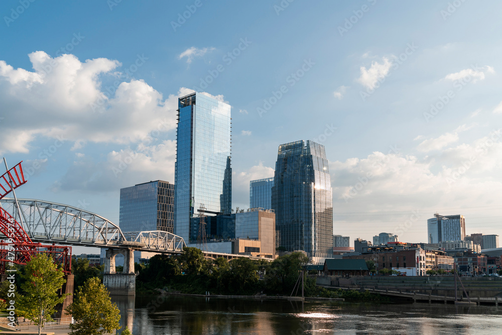 Panoramic skyline view of Broadway district of Nashville over Cumberland River at day time, Tennessee, USA. This city is known as a center for the music industry, especially country music