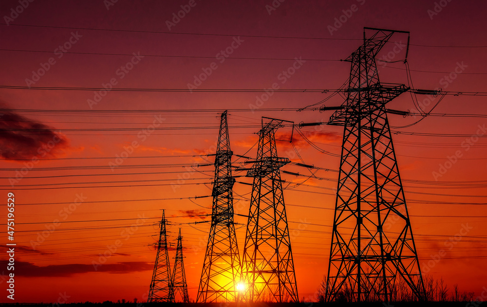  high-voltage  power lines at sunset.