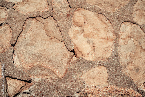 Stone wall background natural color. Closeup photo