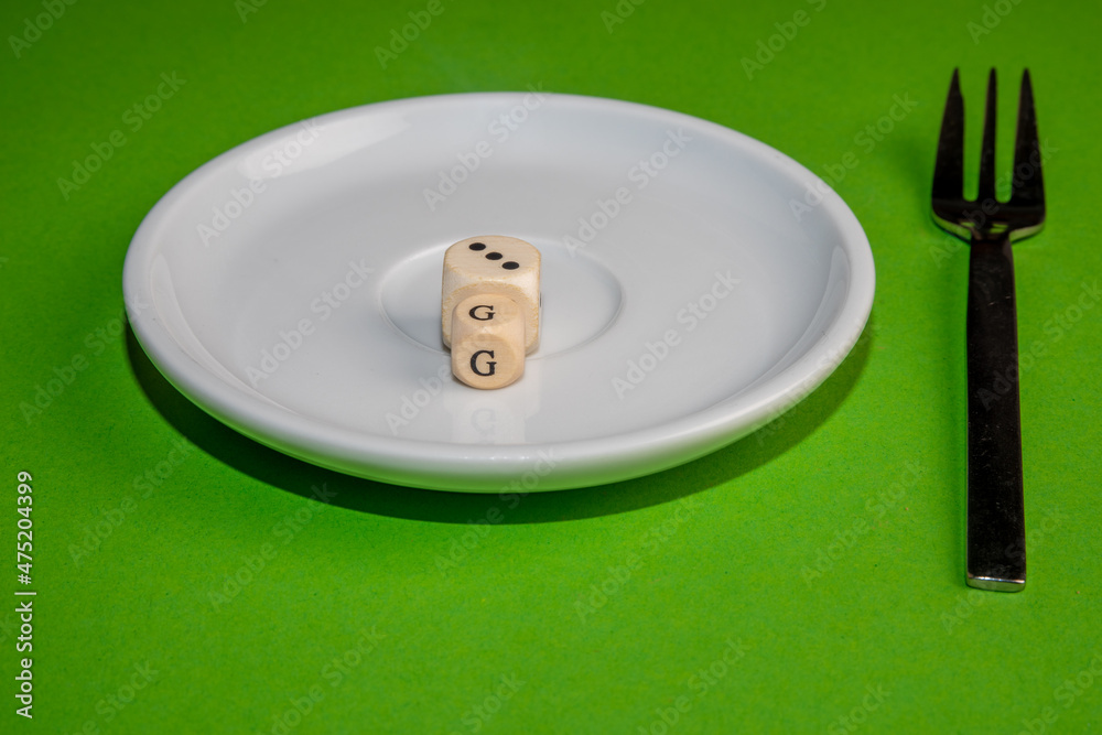 Concept Image for 3G control, white cubes form 3G on a withe plate against a green background Concept Image for 3G control, white cubes form 3G on a withe plate against a green background