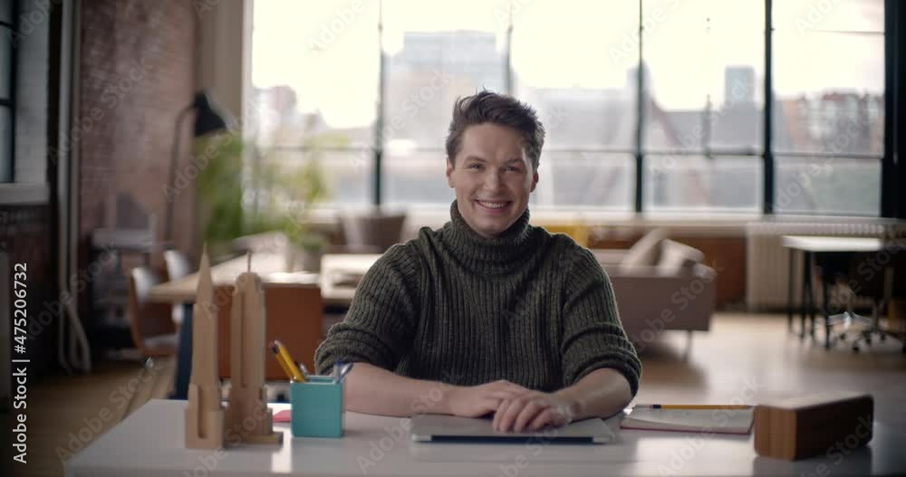 Young professional businessman closes laptop done for the day. Content happy confident handsome smart young adult entrepreneur leader in office Young professional businessman closes laptop done for the day. Content happy confident handsome smart young adult entrepreneur leader in office