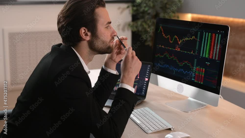 Successful smart broker investor, computer and laptop to analyze the financial market of cryptocurrencies, invests in e-currency, buys or sells crypto coins, analyzes financial data, planning strategy