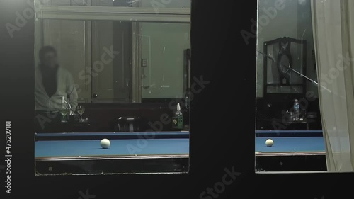 Elderly Men playing Five-pin Billiards in a Bar in Buenos Aires, Argentina.   photo