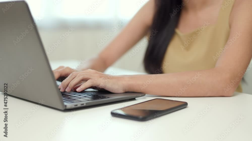 Close up hand woman texting on keyboard laptop work sitting working in office. Close up hand woman texting on keyboard laptop work sitting working in office.