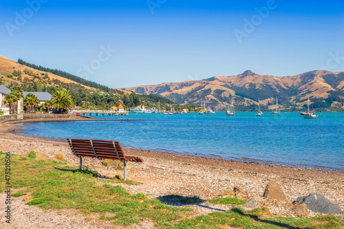 Panoramic View of Akaroa Beach on the Banks Peninsula, southeast of Christchurch, South Island, New Zealand. Seating Area on the Beach.