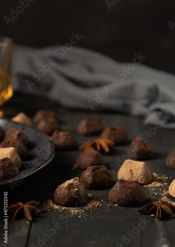 chocolate truffles over rustic wood table