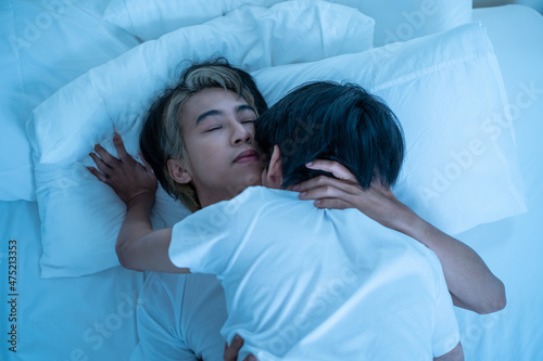 Φωτογραφία Asian attractive male LQBTQ starting foreplay and making love at home