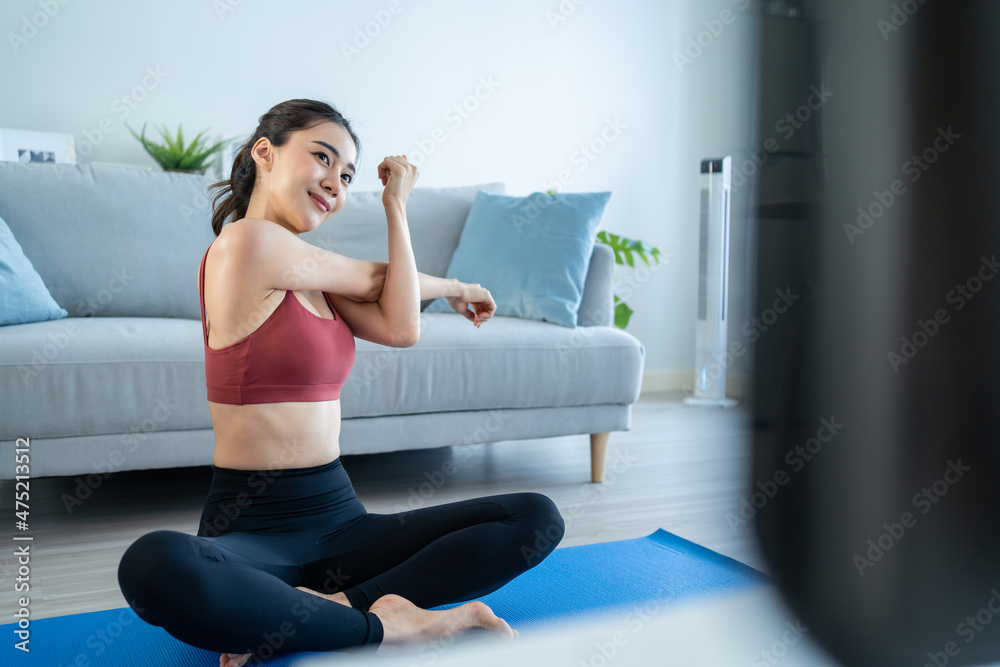 Asian young beautiful active woman doing Yoga Pilates workout at home. Asian young beautiful active woman doing Yoga Pilates workout at home.