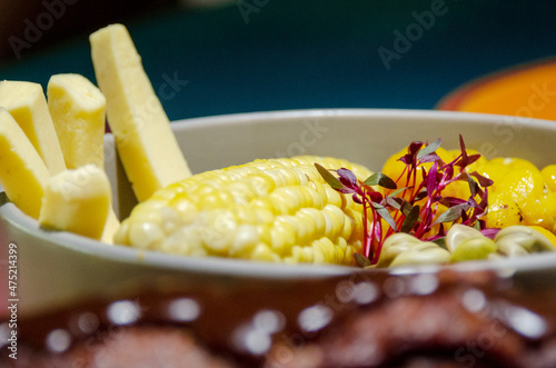 corn with cheese, beans and melloco (choclo con queso, habas y melloco), typical and traditional ecuadorian food.  photo