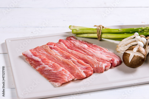Raw meat decorated with ingredients