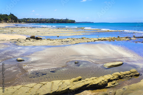 Landscape View of Mairangi Bay Beach Auckland, New Zealand photo