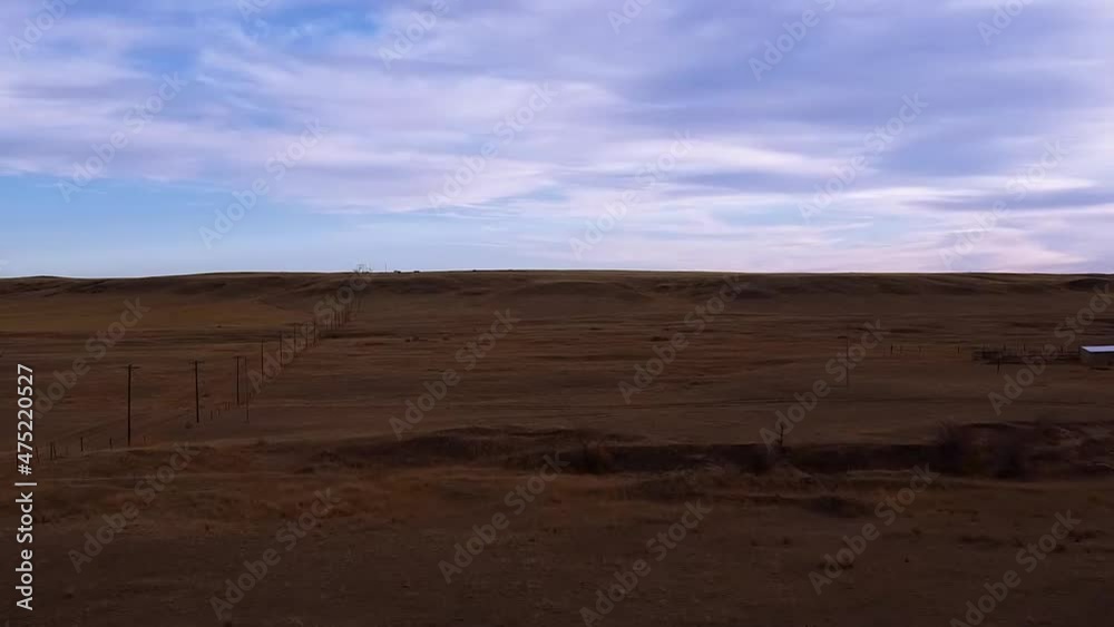 Prairie land in the morning near Alberta Canada filmed from over head with a drone. Prairie land in the morning near Alberta Canada filmed from over head with a drone.